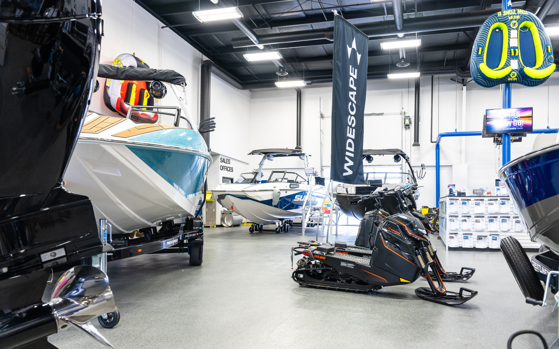 Interior of Martin Motorsports showroom in Calgary featuring boats and power sport vehicles